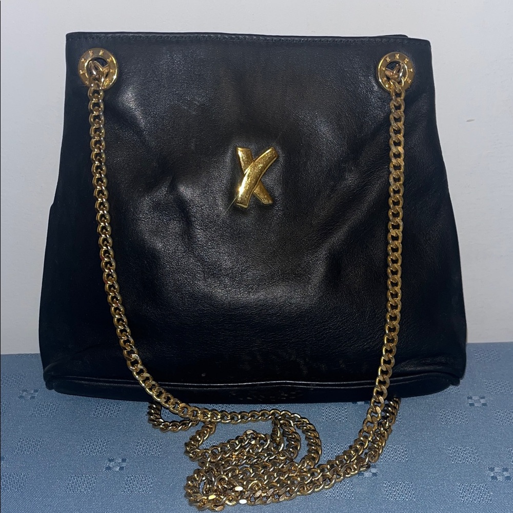 Paloma Picasso vintage black leather shoulder bag with a gold-tone chain strap